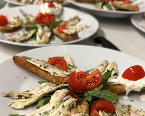 Anchovies with bread and cherry tomatoes